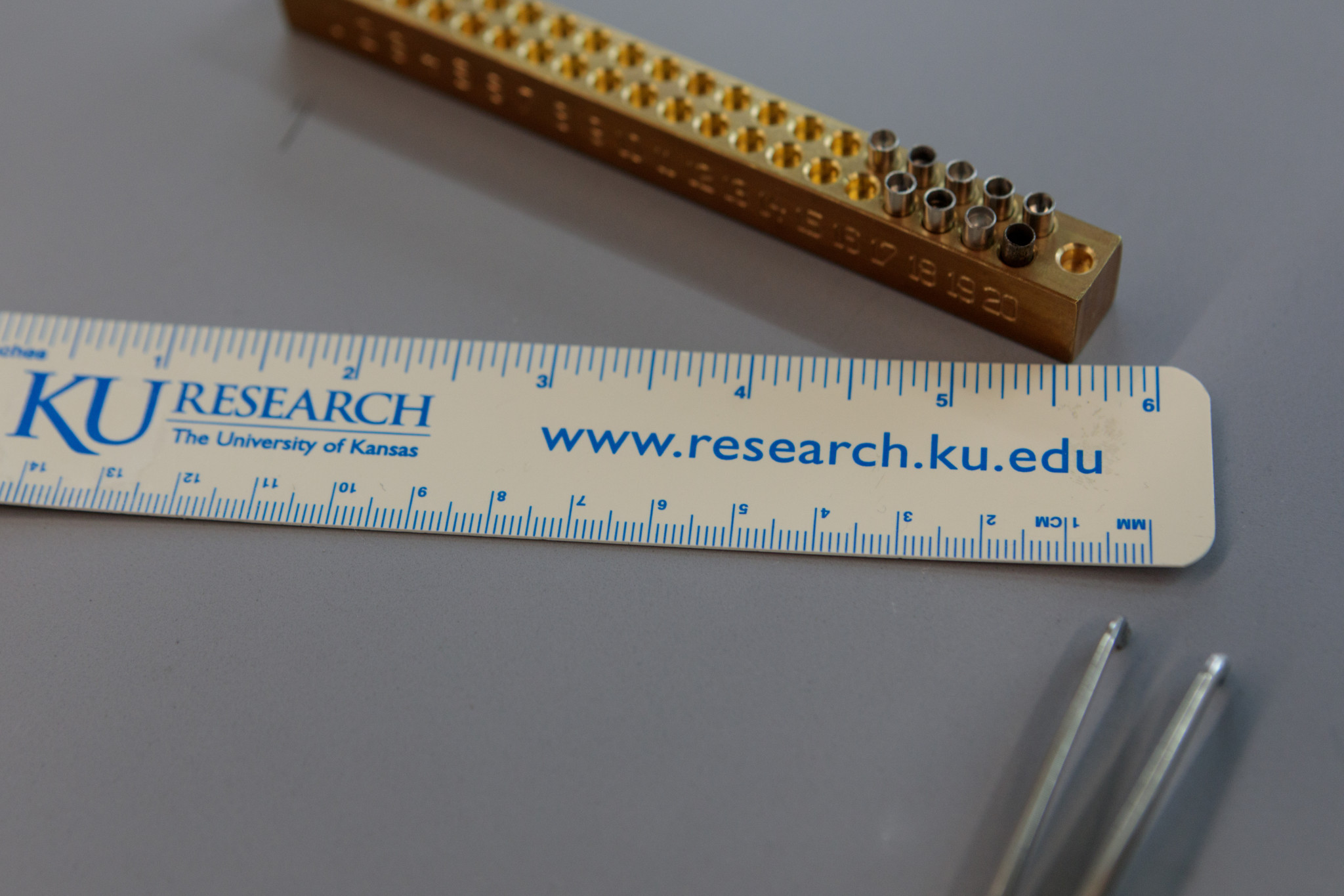 a ruler with KU Research the University of Kansas printed on it along with www.research.ku.edu